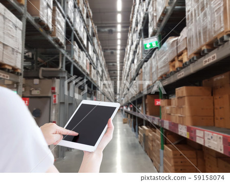 Female manager working at modern warehouse Female manager working at modern warehouse 59158074