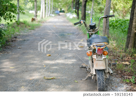 old motorcycle motorbike parked in garden old motorcycle motorbike parked in garden 59158143