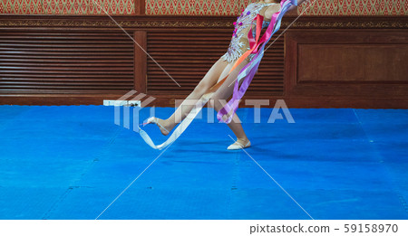 gymnast woman in sportswear dress performing gymnastics 59158970