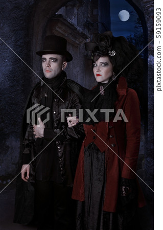 The sinister young couple dressed in vampire style 59159093