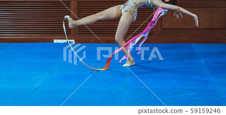 gymnast woman in sportswear dress performing gymnastics 59159246