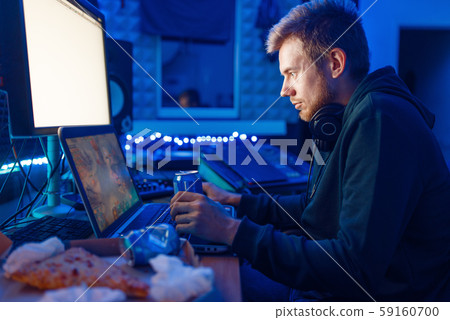 Gamer drinking an energy drink, gaming lifestyle Gamer drinking an energy drink, gaming lifestyle 59160700