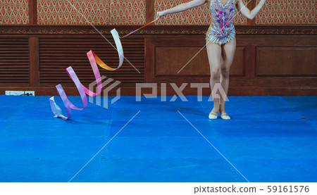 gymnast woman in sportswear dress performing gymnastics 59161576