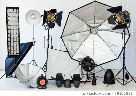 Photo studio equipment flash accessories photographer on a white background Photo studio equipment flash accessories photographer on a white background 59161851