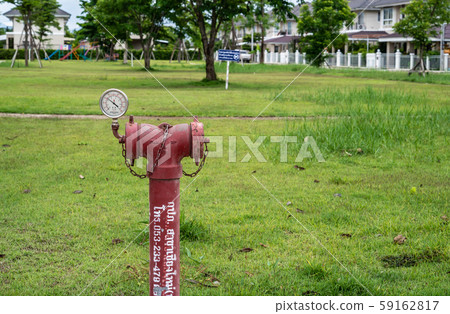 red fire hydrant sits in a freshly cut grass field. red fire hydrant sits in a freshly cut grass field. 59162817