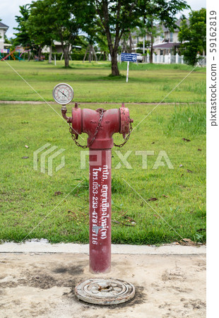 red fire hydrant sits in a freshly cut grass field. red fire hydrant sits in a freshly cut grass field. 59162819