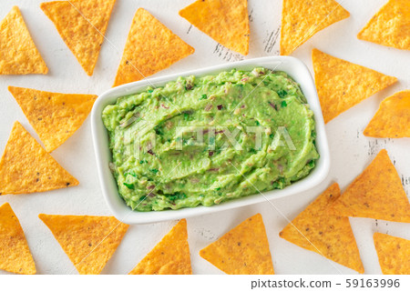 Bowl of guacamole with tortilla chips Bowl of guacamole with tortilla chips 59163996
