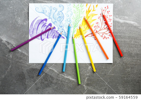 Colored pencils drawing rainbow smoke. Flat lay 59164559