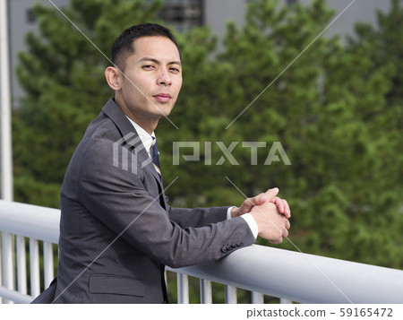 A businessman looking at the camera 59165472