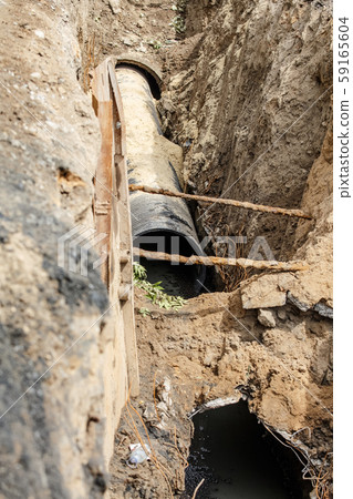 replacement of a sewer pipe deep under the ground replacement of a sewer pipe deep under the ground 59165604