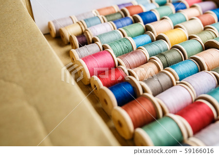 rolls of colorful threads, close-up and top view. 59166016