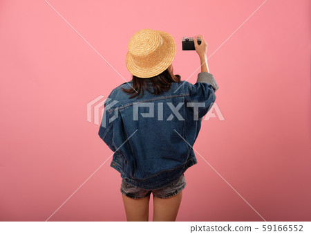 woman backpacker traveler with camera. journey trip travel. studio shot 59166552