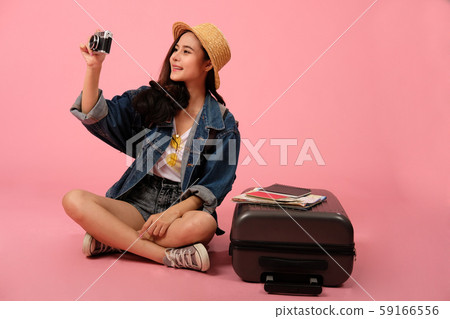 woman backpacker traveler with camera. journey trip travel. studio shot 59166556