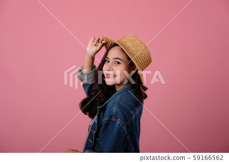 portrait of smiling asian woman wearing jeans jacket. studio shot portrait of smiling asian woman wearing jeans jacket. studio shot 59166562
