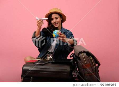 woman backpacker traveler holding globe planning travel destination. journey trip vacation woman backpacker traveler holding globe planning travel destination. journey trip vacation 59166564