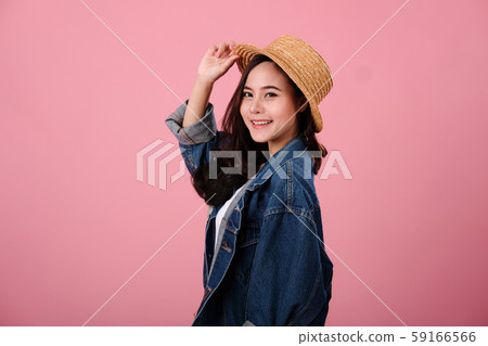 portrait of smiling asian woman wearing jeans jacket. studio shot portrait of smiling asian woman wearing jeans jacket. studio shot 59166566