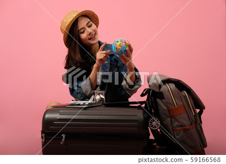 woman backpacker traveler holding globe planning travel destination. journey trip vacation woman backpacker traveler holding globe planning travel destination. journey trip vacation 59166568