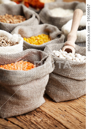 Corn kernel seed meal and grains in bags isolated Corn kernel seed meal and grains in bags isolated 59166667