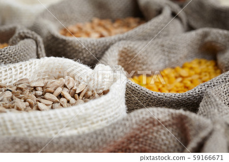 Corn kernel seed meal and grains in bags isolated Corn kernel seed meal and grains in bags isolated 59166671