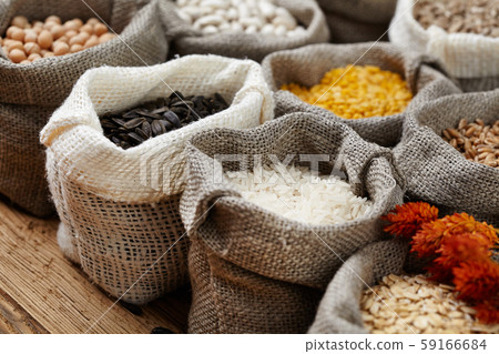 Corn kernel seed meal and grains in bags isolated Corn kernel seed meal and grains in bags isolated 59166684