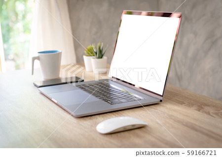 Laptop computer with blank screen on table. Laptop computer with blank screen on table. 59166721