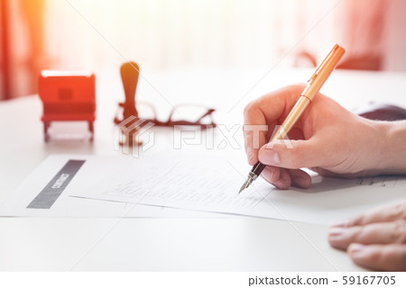 Lawyer working in office. Notary signs document Lawyer working in office. Notary signs document 59167705