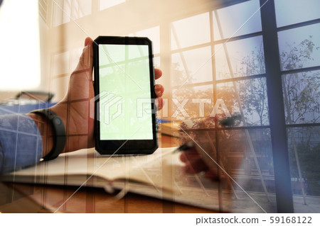man writing note on notebook. businessman working organizing plan with smart phone at workplace man writing note on notebook. businessman working organizing plan with smart phone at workplace 59168122