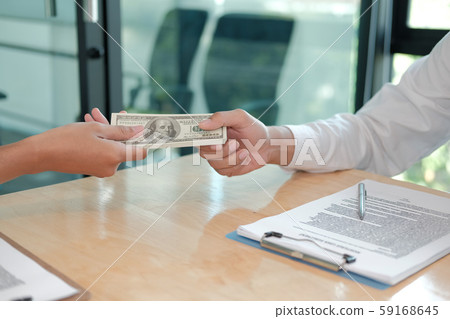 Businessman receiving money. woman giving cash Businessman receiving money. woman giving cash 59168645
