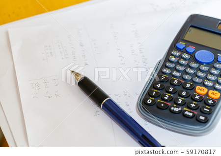 Math problems and pen and calculator 59170817
