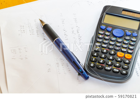 Math problems and pen and calculator 59170821