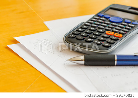 Math problems and pen and calculator Math problems and pen and calculator 59170825