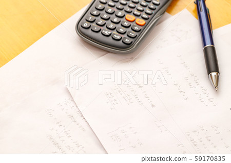 Math problems and pen and calculator 59170835