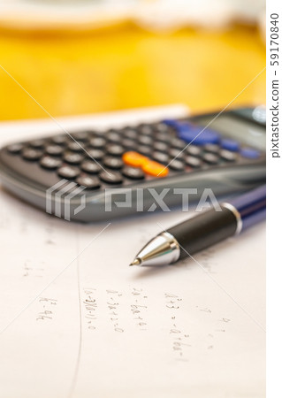 Math problems and pen and calculator 59170840