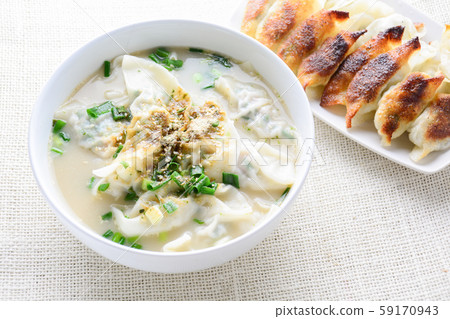 Wonton soup with spring onion served in a white Wonton soup with spring onion served in a white 59170943
