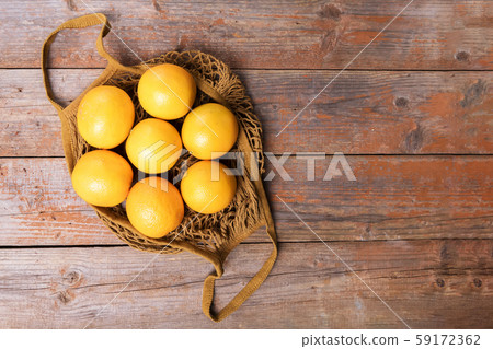Top view of fresh organic oranges in string bag Top view of fresh organic oranges in string bag 59172362
