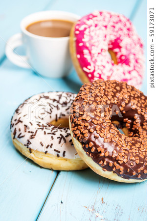 Sweet donuts on black stone table Sweet donuts on black stone table 59173071