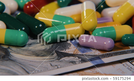 Medical pills are on the dollars. Expensive drugs, pharmaceutical business. The development and Medical pills are on the dollars. Expensive drugs, pharmaceutical business. The development and 59175294
