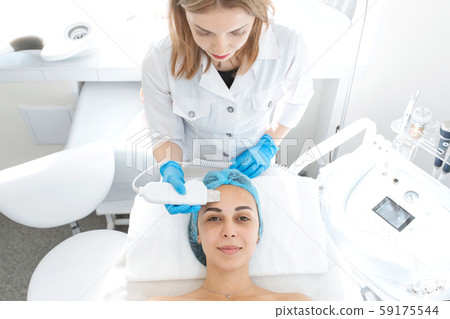 Portrait of a young beautiful girl. Cosmetic face Portrait of a young beautiful girl. Cosmetic face 59175544