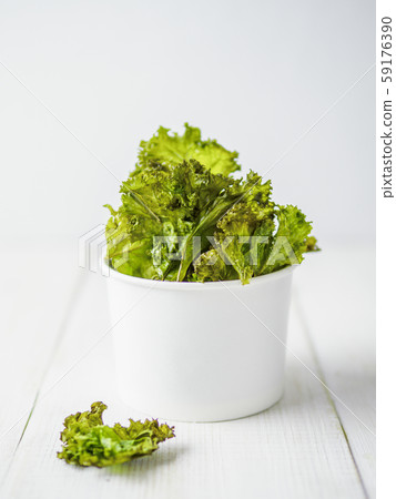 Homemade kale chips ready-to-eat, copy space left 59176390