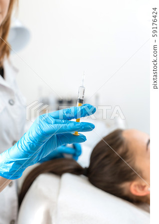 Close-up, the beautician makes injections of Close-up, the beautician makes injections of 59176424