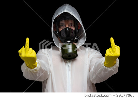 Outraged by toxic pollution, a man in a gas mask 59177063