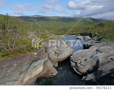 Blue glacial river canyon with granite rork 59178221