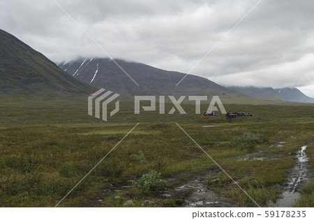 Red helicopter supply Hikers at Mountain Lodge 59178235