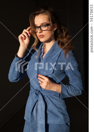 portrait of a beautiful business woman in a business suit at work in the office portrait of a beautiful business woman in a business suit at work in the office 59178655