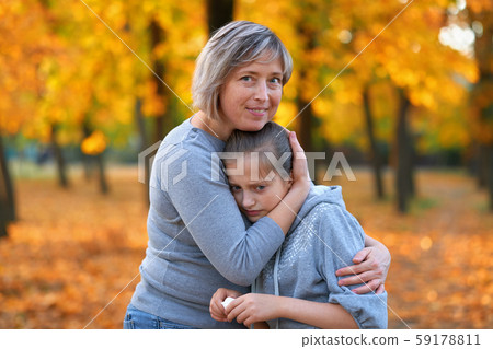 Portrait of mother with her sad daughter in autumn Portrait of mother with her sad daughter in autumn 59178811