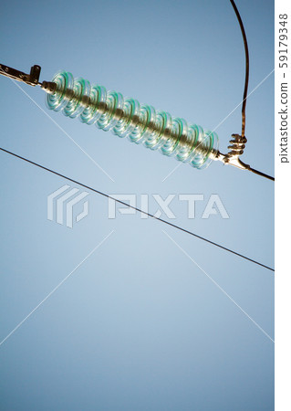 Close-up bottom view of insulators on high-voltage 59179348