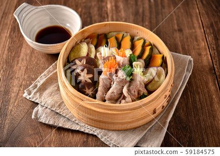 Steamed organic pork rolls with vegetables Steamed organic pork rolls with vegetables 59184575