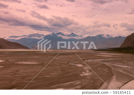 landscape view of the Indus river flowing through Katpana cold desert in Skardu, Gilgit Baltistan, Pakistan. landscape view of the Indus river flowing through Katpana cold desert in Skardu, Gilgit Baltistan, Pakistan. 59185411