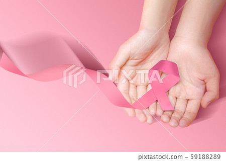 Human hands showing pink awareness ribbon 59188289