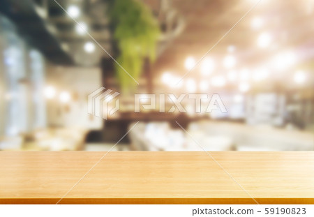 Wood table in blur background of modern restaurant 59190823